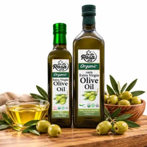 De La Rosa 613 organic extra virgin olive oil bottles with fresh olives and a bowl of olive oil