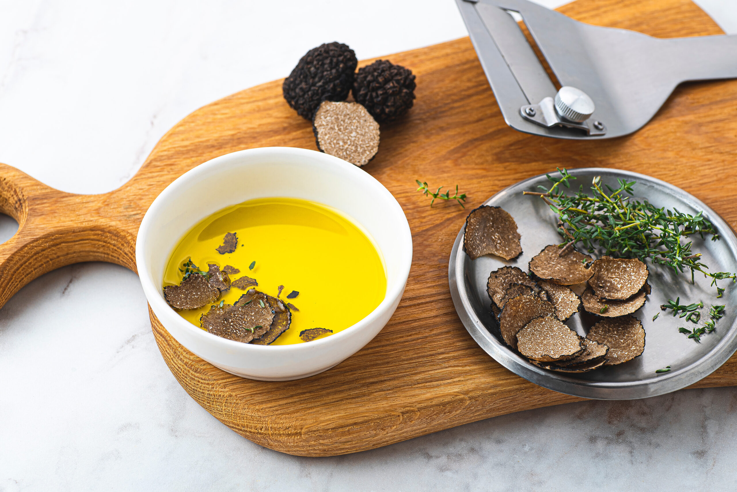 Olive oil with black truffles. How to preserve the aroma of truffles. Fragrant autumn oil, gourmet supplement. Autumn gourmet cuisine of Piedmont, Northern Italy